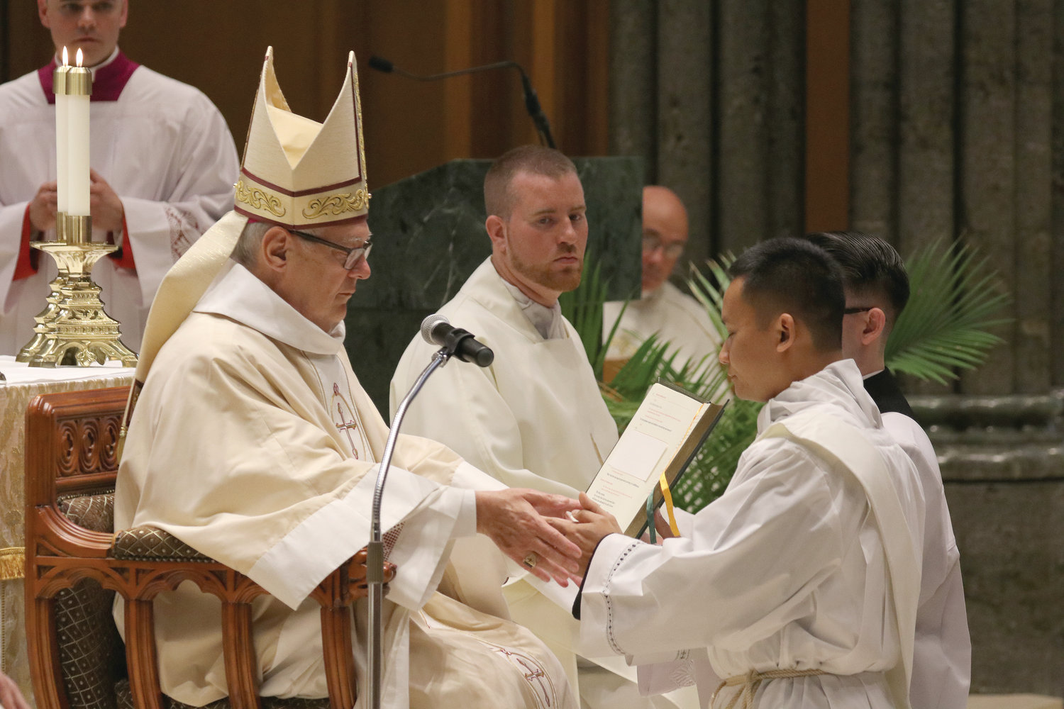 Father Nguyen humbly step forth to offer the Promise of the Elect.